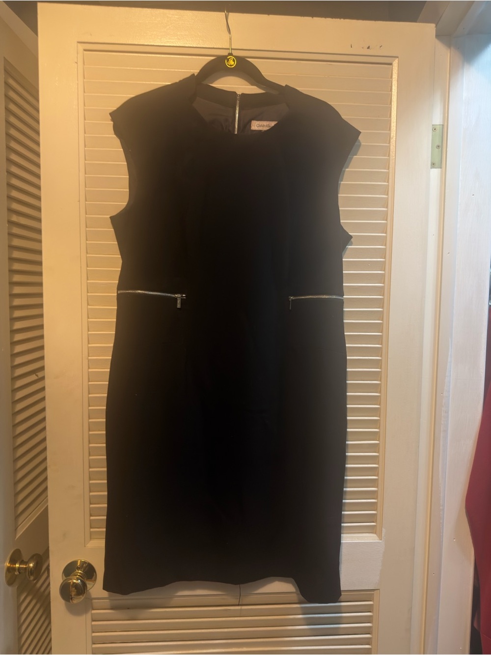 Calvin Klein Classic Black Sleeveless Sheath Dress with Zip Pocket Detail